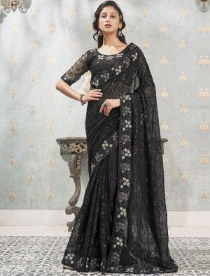 Rose gold georgette saree with black sequins border. Fabric
