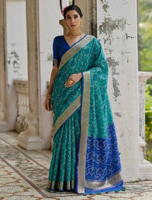 Teal Raw Silk Blend Saree With Ikat Weaving